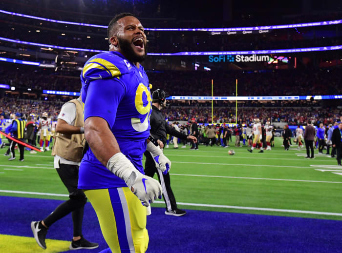 Jan 30, 2022; Inglewood, California, USA; Los Angeles Rams defensive end Aaron Donald (99) celebrates in the fourth quarter during the NFC Championship Game against the San Francisco 49ers at SoFi Stadium. Mandatory Credit: Gary A. Vasquez-USA TODAY Sports